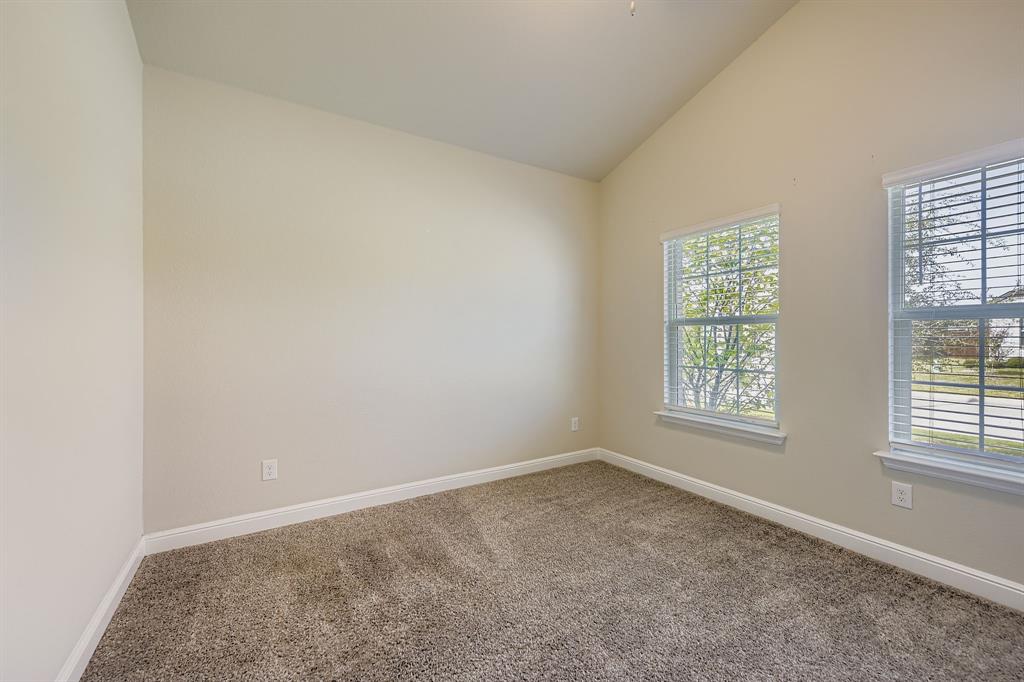 1829 Ruffian Road Granbury, TX 76049 - Photo 6 of 39 an empty room with a window
