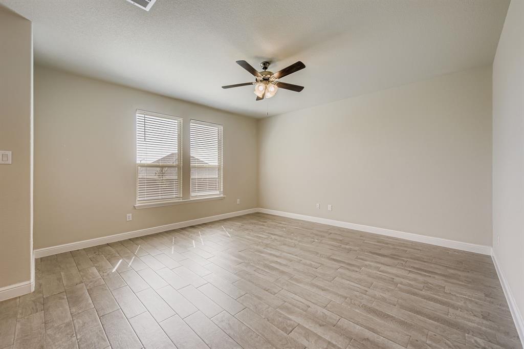 1829 Ruffian Road Granbury, TX 76049 - Photo 8 of 39 wooden floor in an empty room with a window