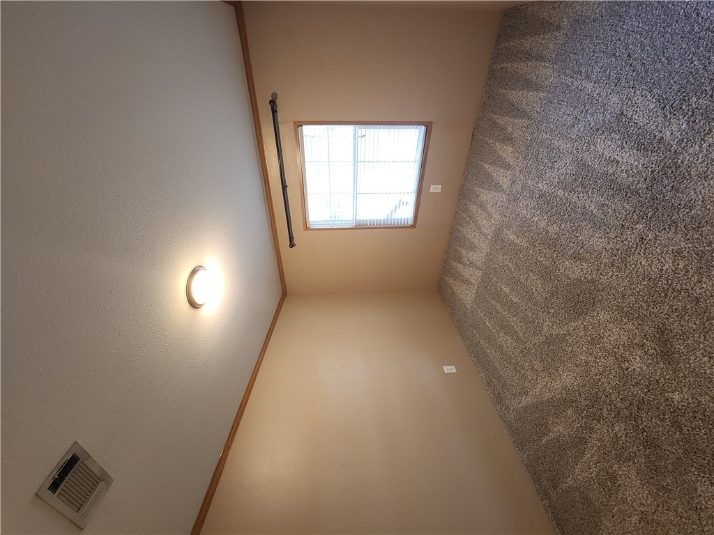 3738 Smetana Road Bryan, TX 77807 - Photo 18 of 29 an empty room with a empty space and windows