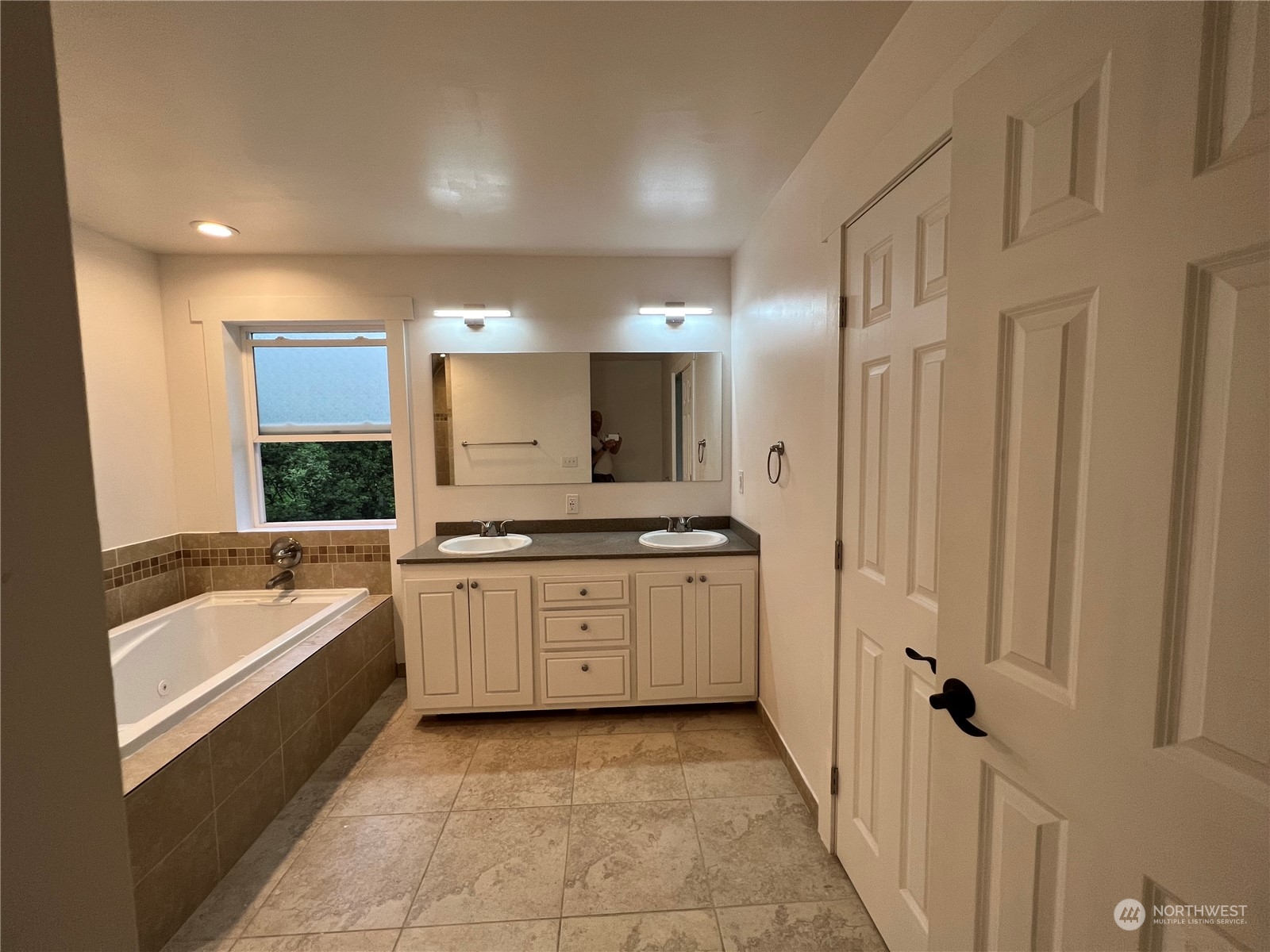 8229 South 132nd Street Seattle, WA 98178 - Photo 5 of 15 a bathroom with a granite countertop sink mirror and bathtub