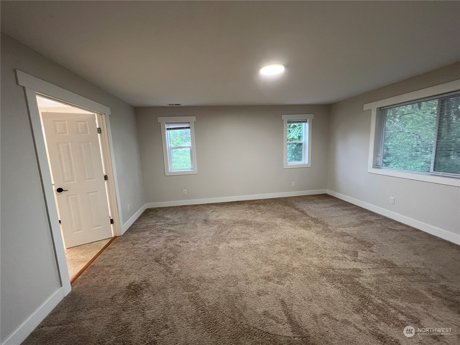 8229 South 132nd Street Seattle, WA 98178 - Photo 7 of 15 an empty room with windows