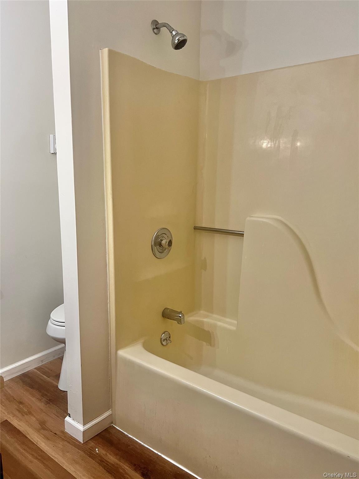 188 River Road, Unit B Wallkill, NY 12589 - Photo 14 of 20 a bathroom with a bathtub and a toilet