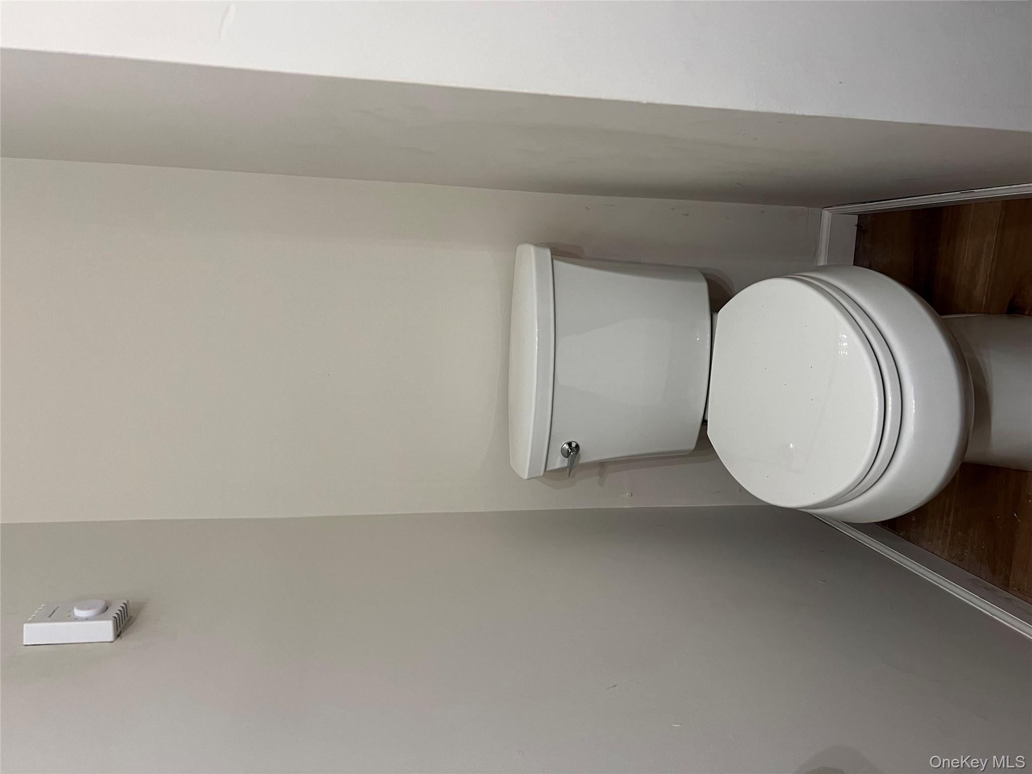 188 River Road, Unit B Wallkill, NY 12589 - Photo 16 of 20 a white toilet sitting next to a white wall