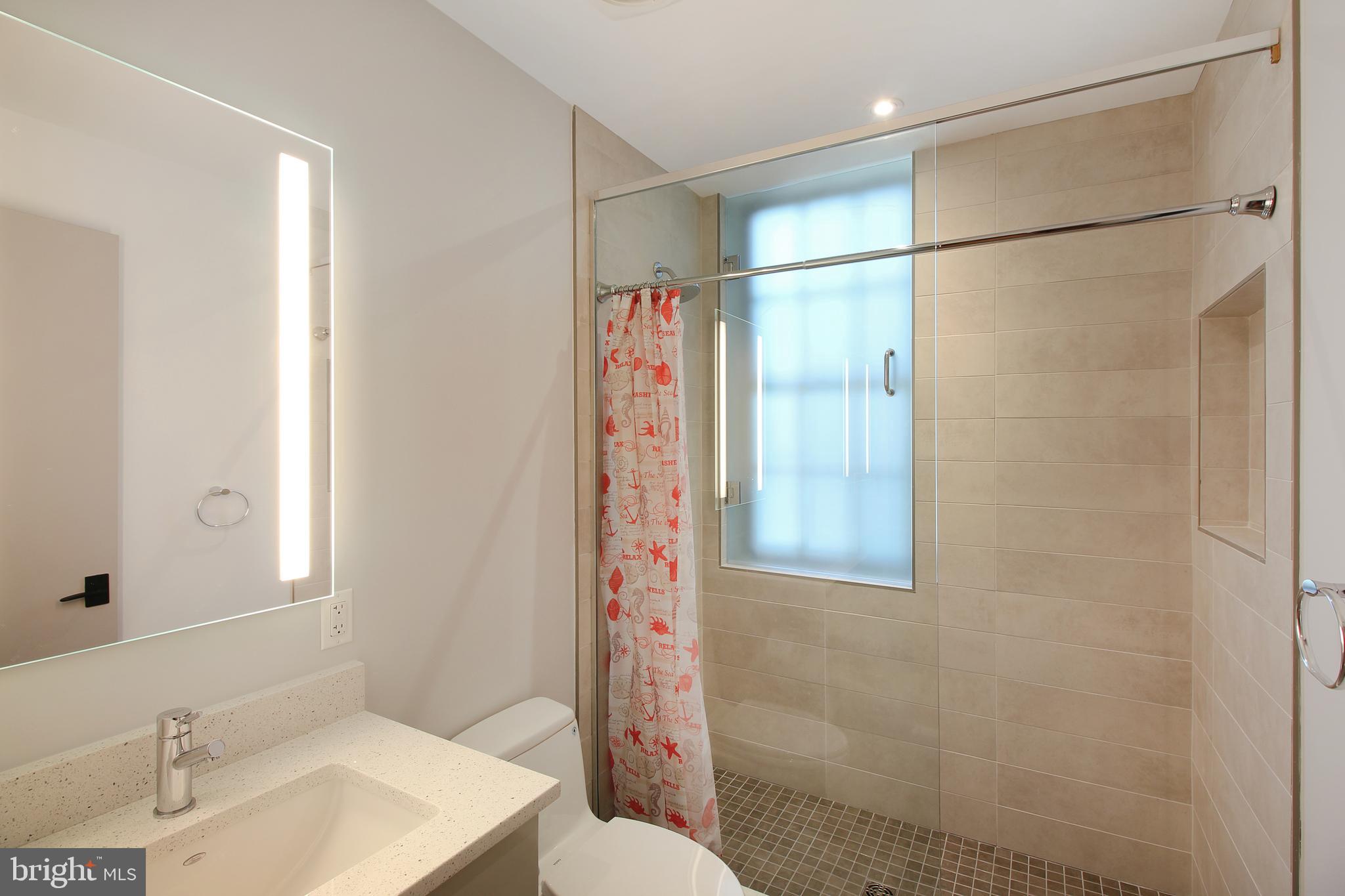 448 K Street Northwest, Unit 301 Washington, DC 20001 - Photo 11 of 25 a bathroom with a shower and a sink