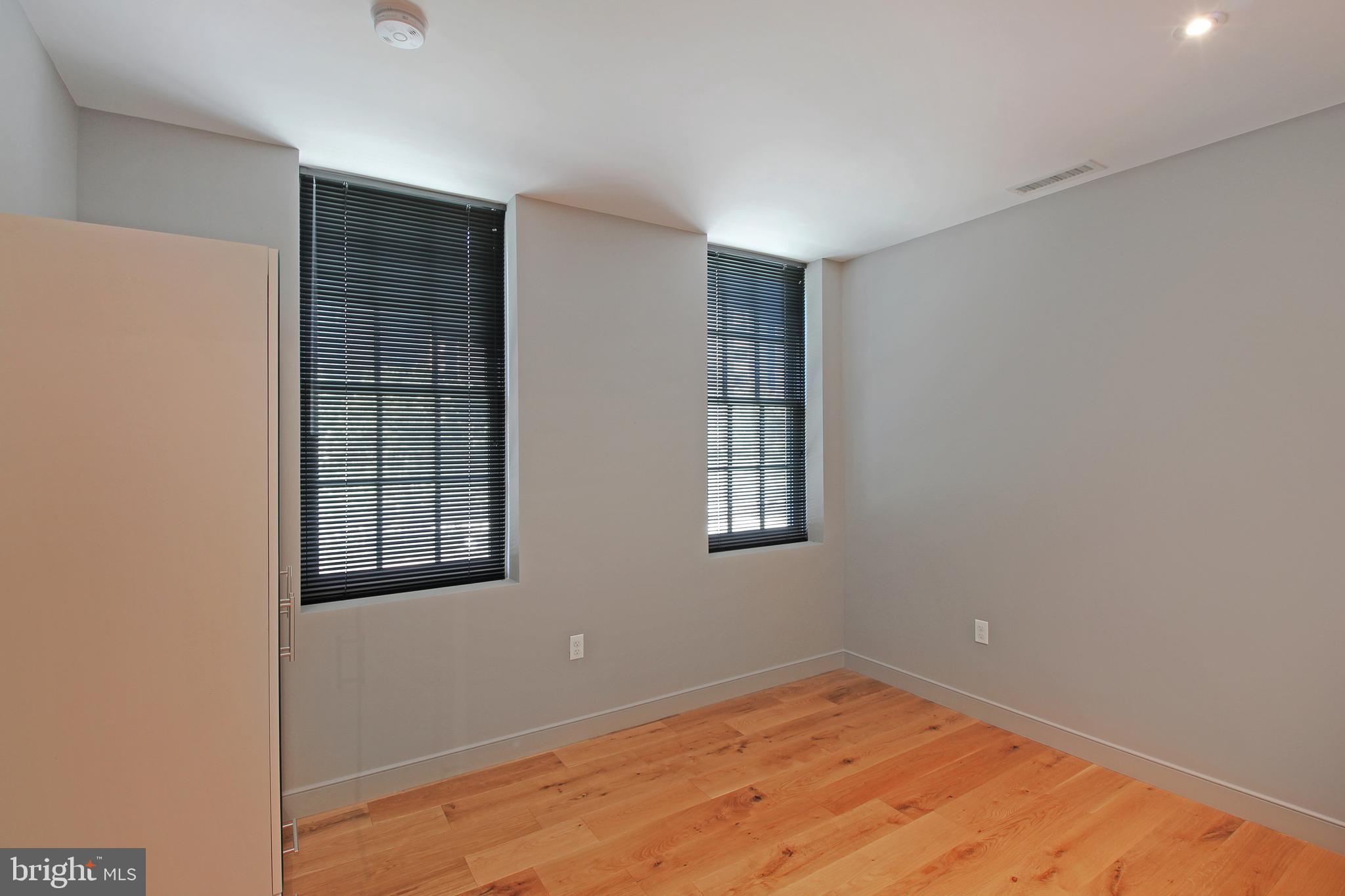 448 K Street Northwest, Unit 301 Washington, DC 20001 - Photo 13 of 25 an empty room with windows