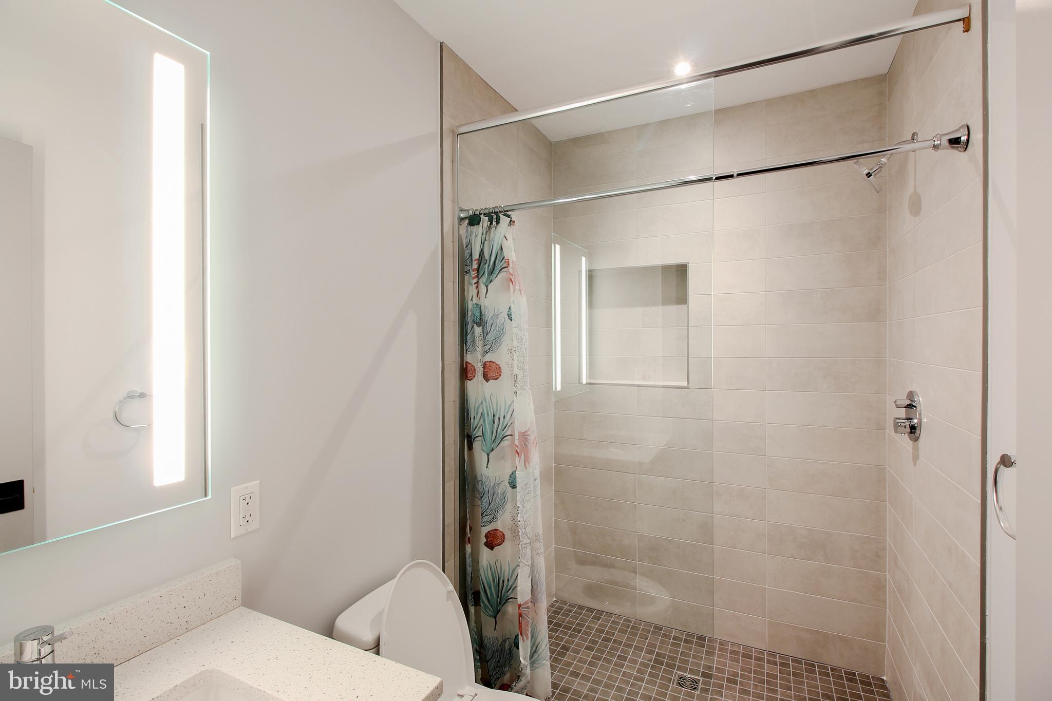 448 K Street Northwest, Unit 301 Washington, DC 20001 - Photo 15 of 25 a bathroom with a shower and a toilet
