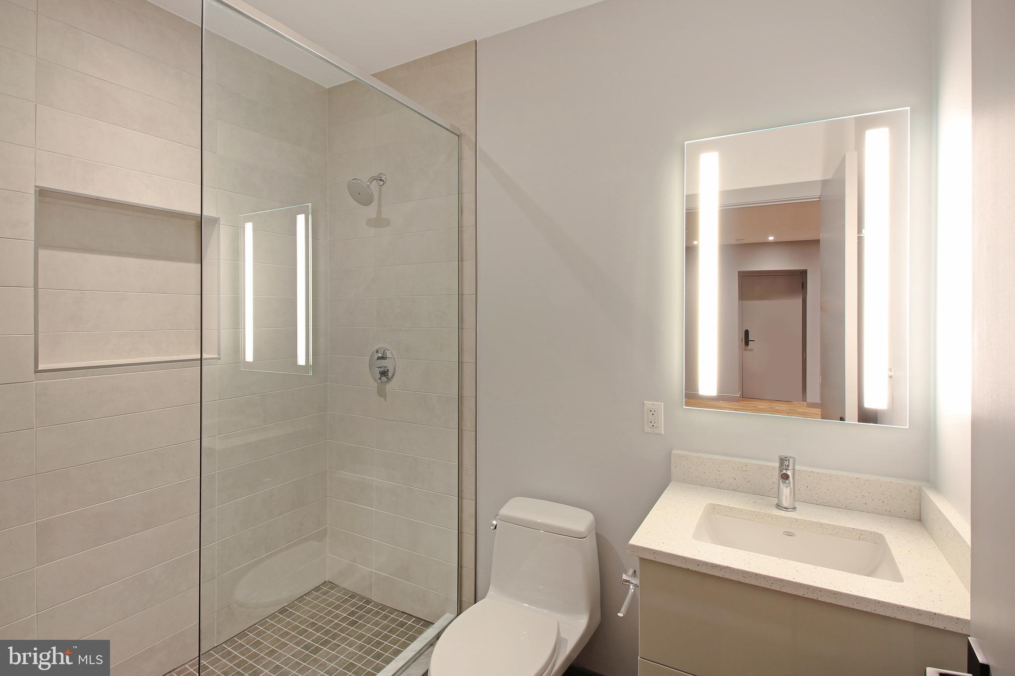 448 K Street Northwest, Unit 301 Washington, DC 20001 - Photo 16 of 25 a bathroom with a sink toilet and shower
