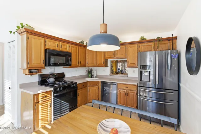 a view of a dining room with furniture and window