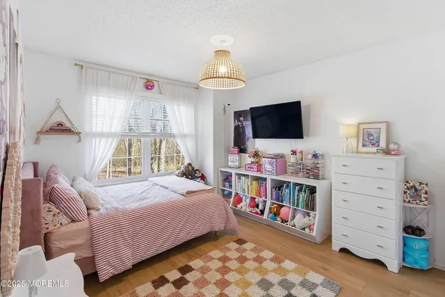 a bathroom with a sink vanity mirror and toilet