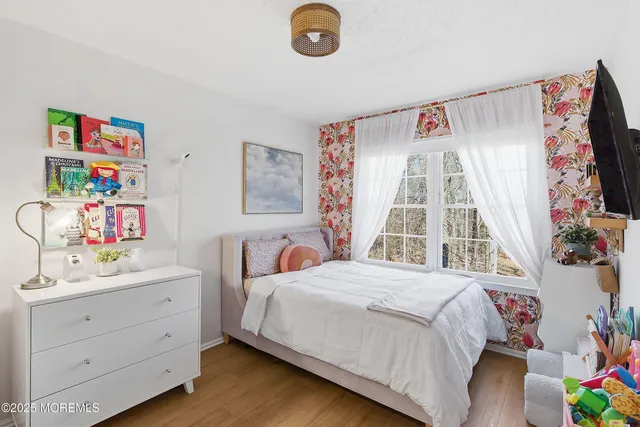 a view of a patio with couches chairs and wooden floor
