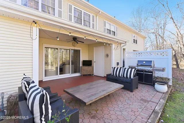 a front view of a house with a yard and outdoor seating