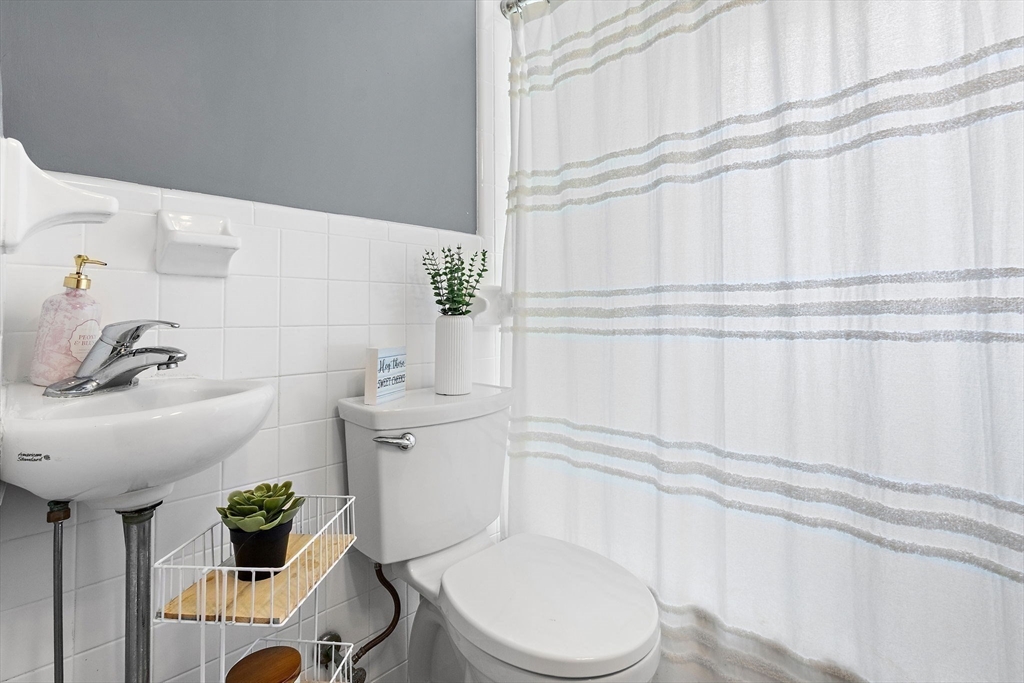 61 Pine Ridge Drive Franklin, MA 02038 - Photo 19 of 41 a bathroom with a sink toilet and shower