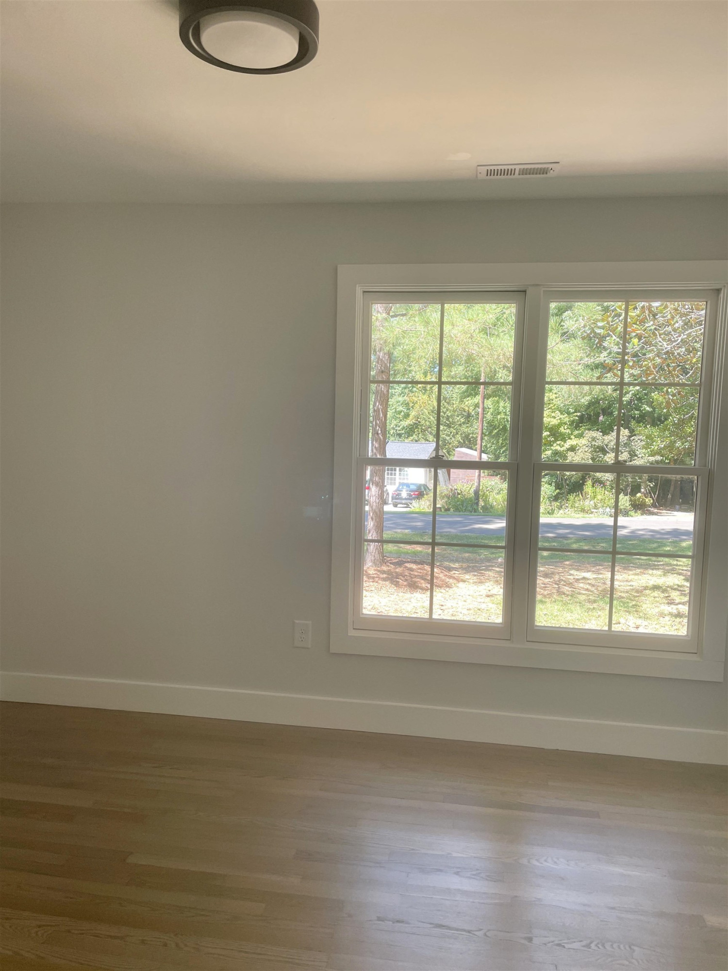 245 Marilyn Circle Cary, NC 27513 - Photo 17 of 21 a room with a window and a wooden floor