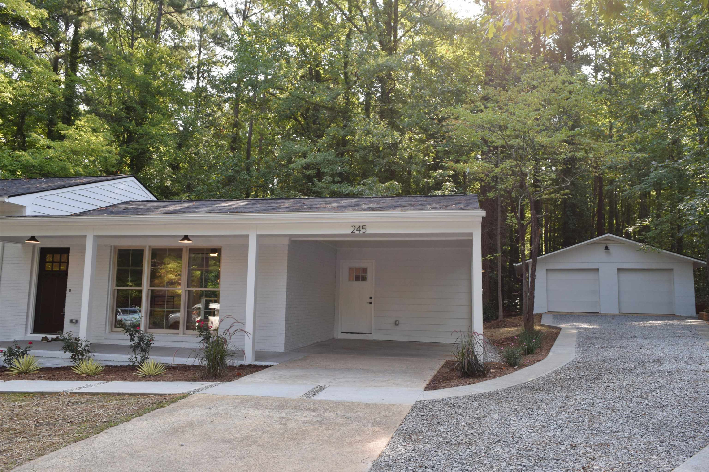 245 Marilyn Circle Cary, NC 27513 - Photo 2 of 21 a view of a house with a yard and large tree