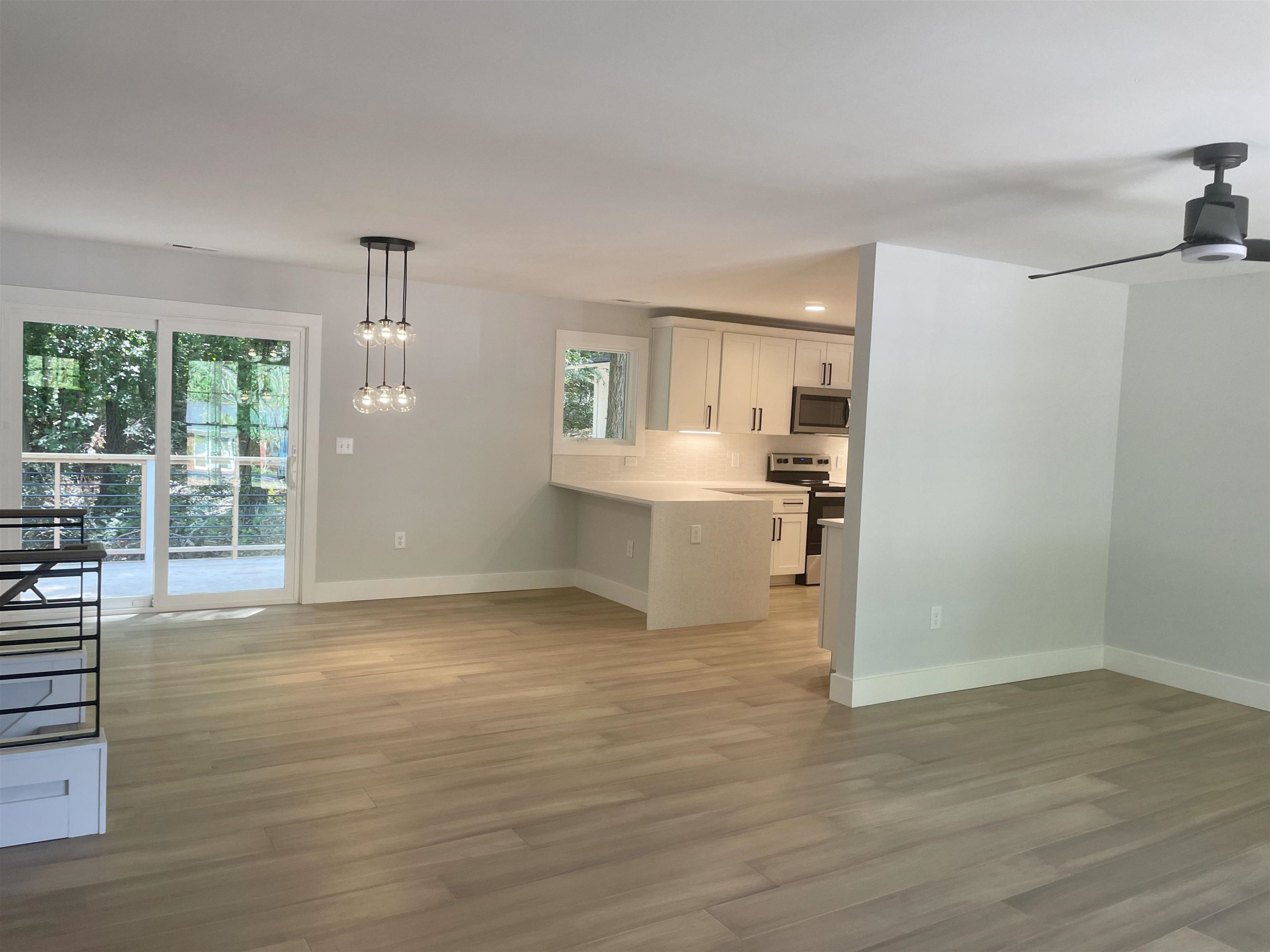 245 Marilyn Circle Cary, NC 27513 - Photo 4 of 21 a view of a kitchen with wooden floor and a window