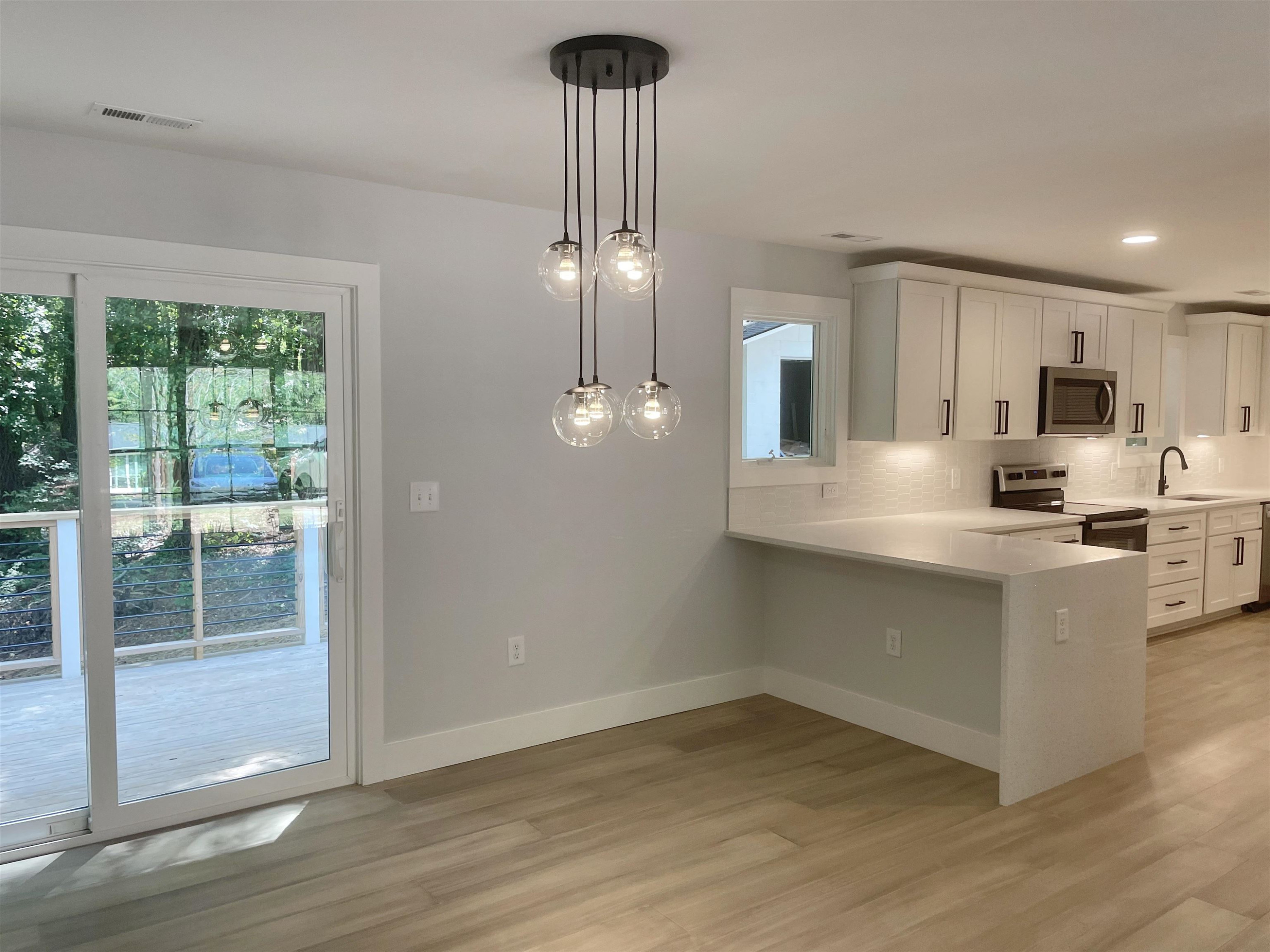 245 Marilyn Circle Cary, NC 27513 - Photo 6 of 21 a kitchen with kitchen island a counter top space appliances and cabinets