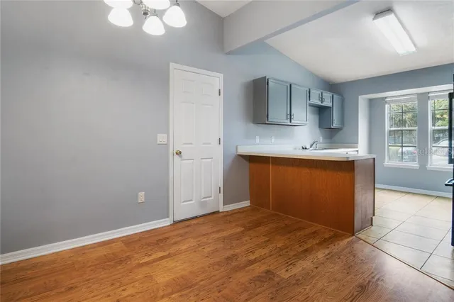 a view of a kitchen with a sink and a window