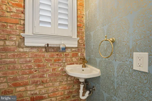 a bathroom with a sink a mirror and a shower