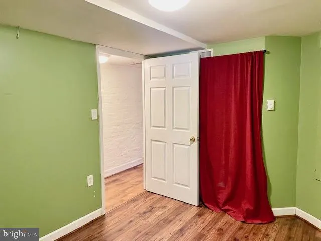 a view of a room with wooden floor and wooden walls