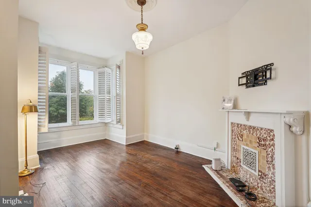 a view of livingroom with furniture wooden floor and front door