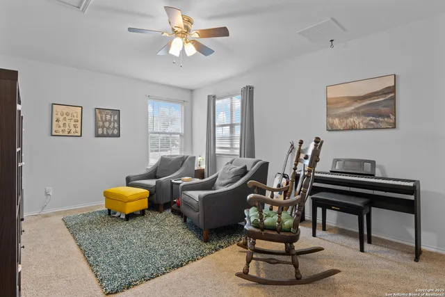 a living room with furniture and a rug