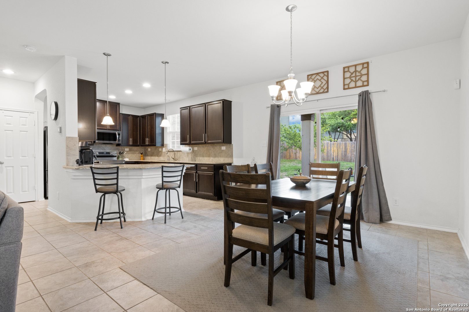 512 Granite Mist Universal City, TX 78148 - Photo 4 of 16 a view of a dining room with furniture window and outside view