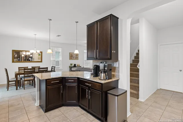 a kitchen with a sink and cabinets