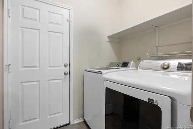 a utility room with dryer and washer