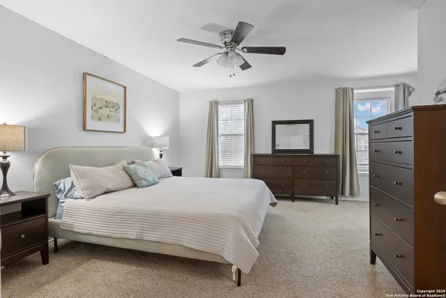 a bedroom with a bed and a dresser