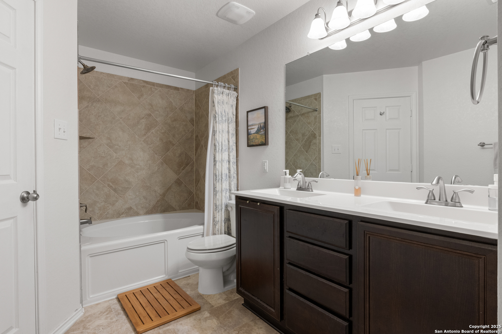 512 Granite Mist Universal City, TX 78148 - Photo 10 of 16 a bathroom with a double vanity sink toilet and shower