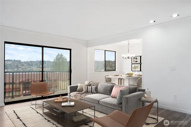 a living room with furniture and a floor to ceiling window