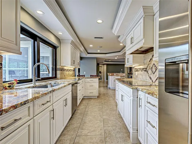 a living room with couch and a floor to ceiling window