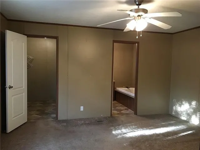 a kitchen with a sink cabinets and window