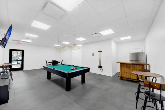 a room with pool table and projector furniture