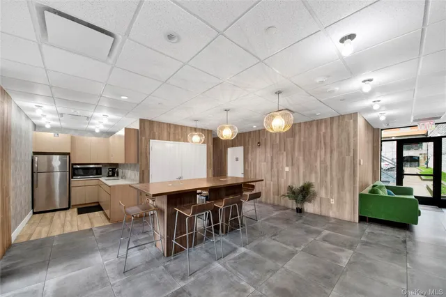 a large room with lots of furniture and a chandelier