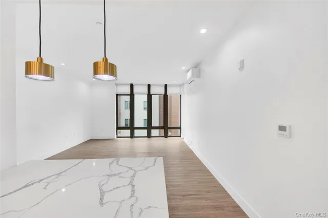 a view of a hallway with washer and dryer