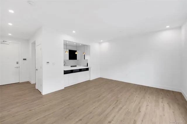 a view of a kitchen with wooden floor