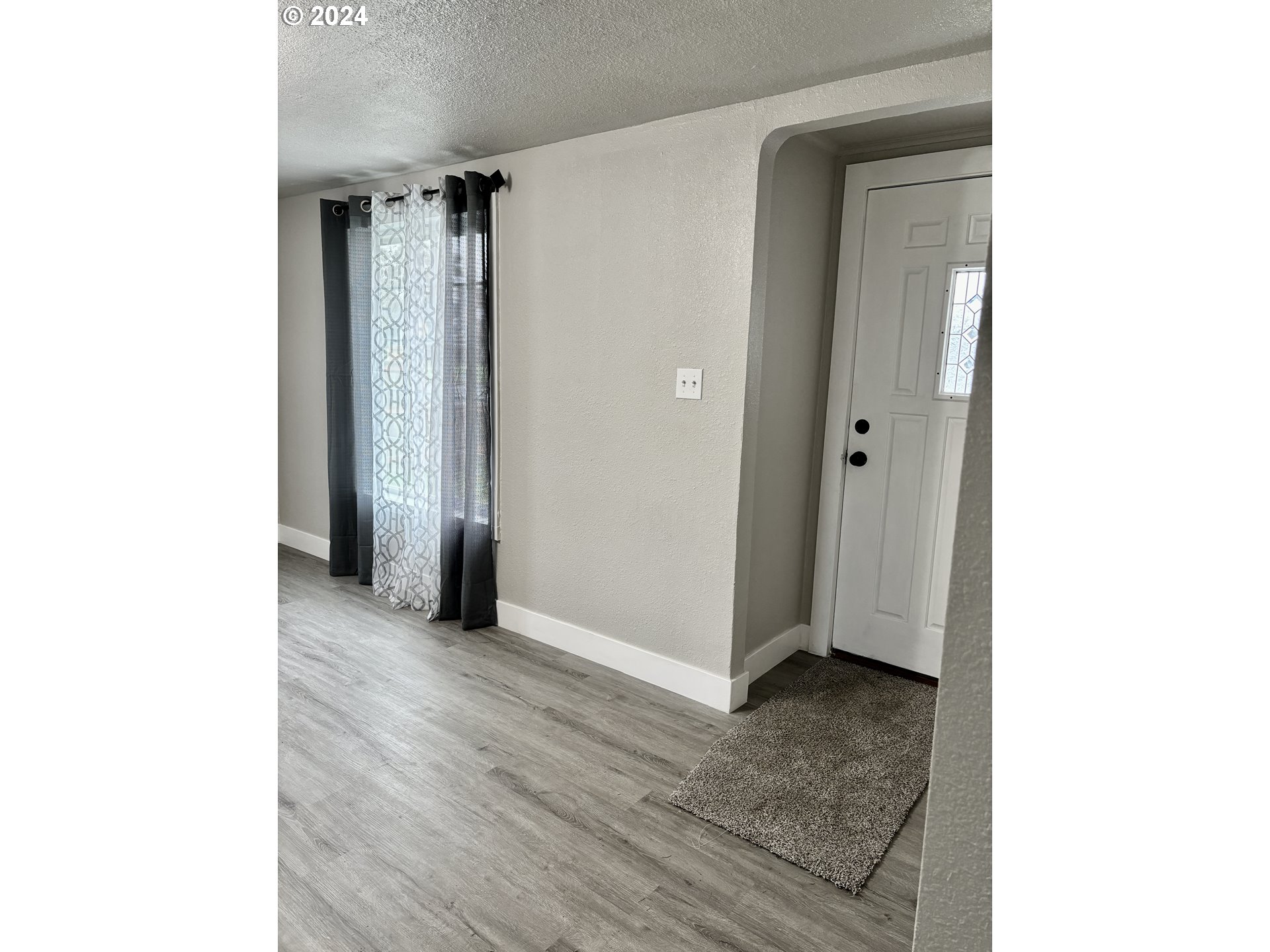 545 22nd Street Springfield, OR 97477 - Photo 11 of 25 a view of a room with wooden floor and a bathroom