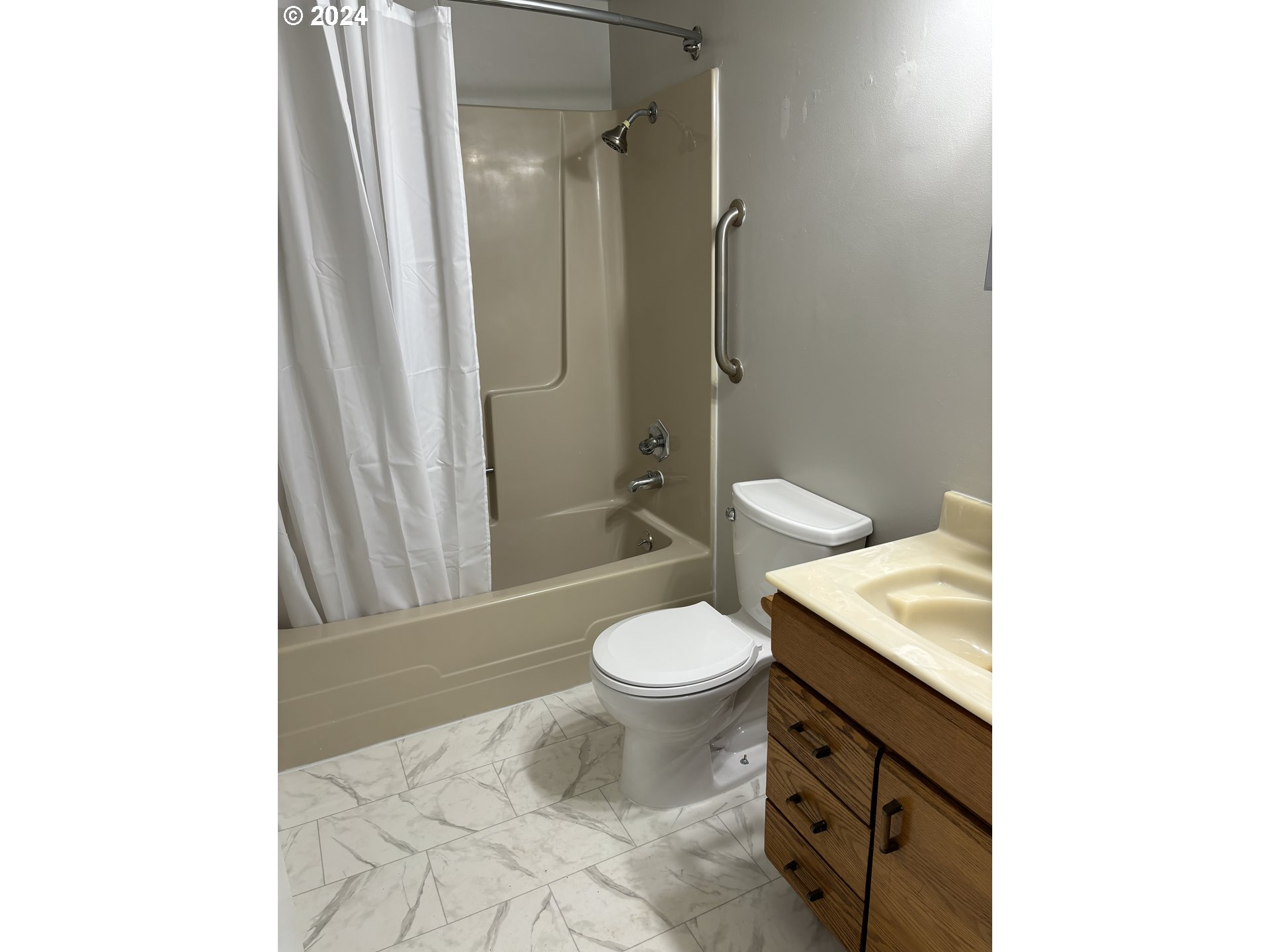 545 22nd Street Springfield, OR 97477 - Photo 16 of 25 a bathroom with a granite countertop toilet a sink and a mirror