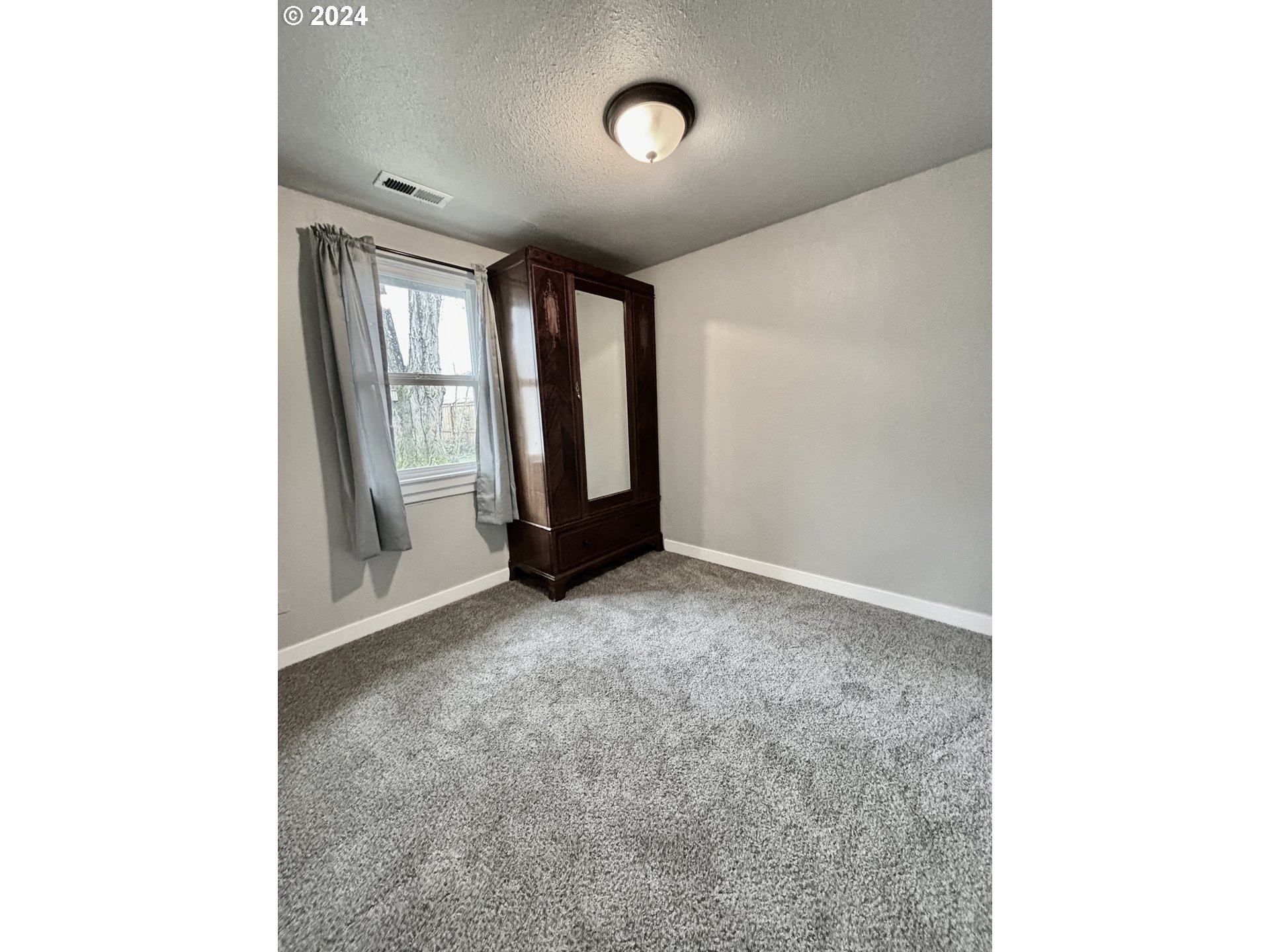 545 22nd Street Springfield, OR 97477 - Photo 19 of 25 a view of an empty room with a window