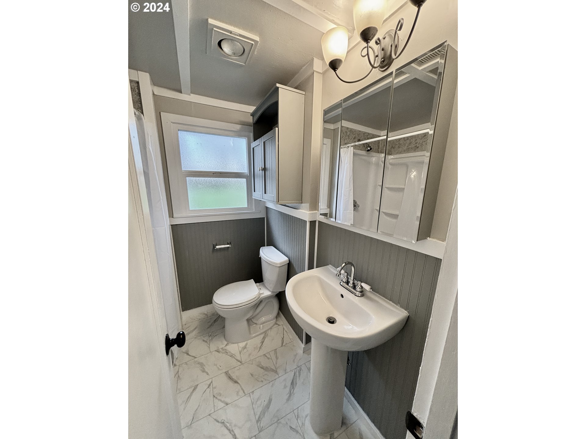 545 22nd Street Springfield, OR 97477 - Photo 20 of 25 a bathroom with a sink a toilet and mirror