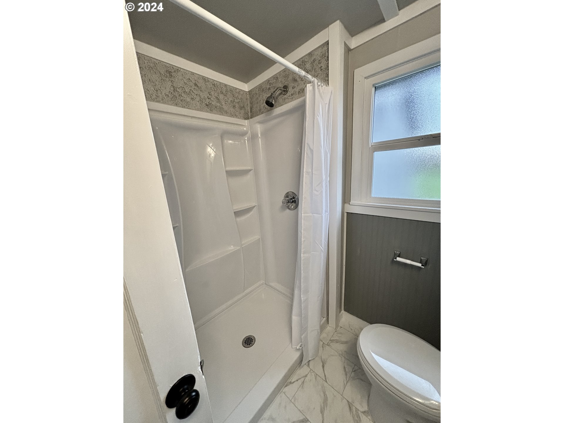 545 22nd Street Springfield, OR 97477 - Photo 21 of 25 a bathroom with a granite countertop shower a toilet and a sink