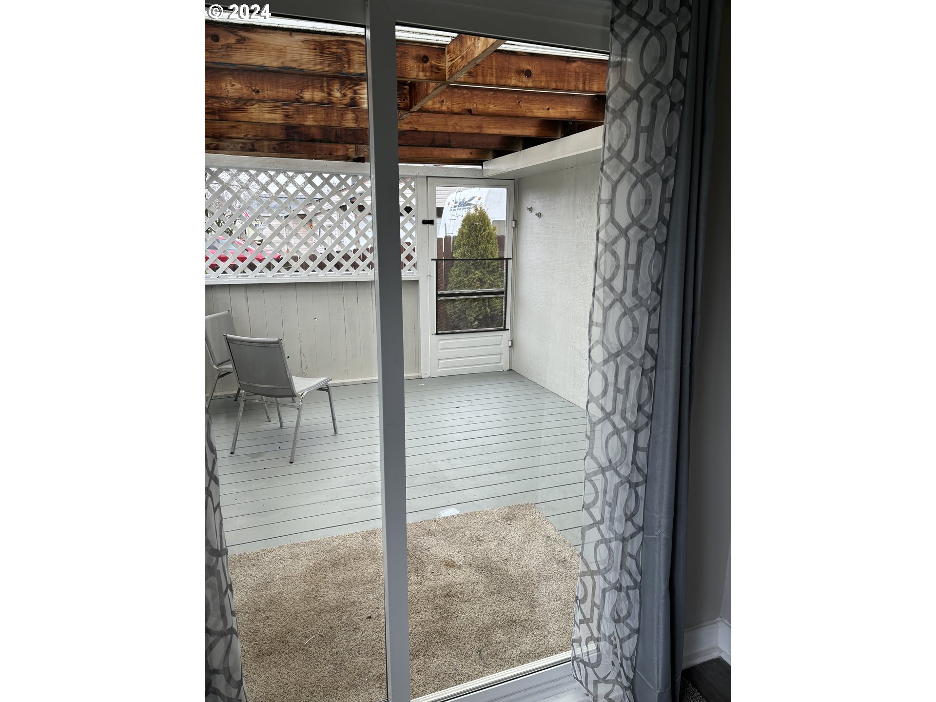 545 22nd Street Springfield, OR 97477 - Photo 6 of 25 a view of a glass door and chair