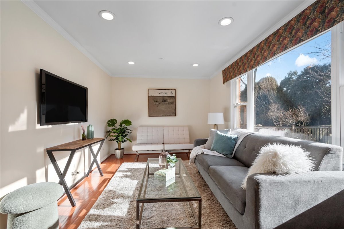 2440 Simpson Street Evanston, IL 60201 - Photo 16 of 34 a living room with furniture and a flat screen tv
