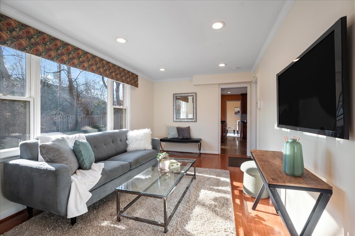 2440 Simpson Street Evanston, IL 60201 - Photo 17 of 34 a living room with fireplace furniture and a flat screen tv