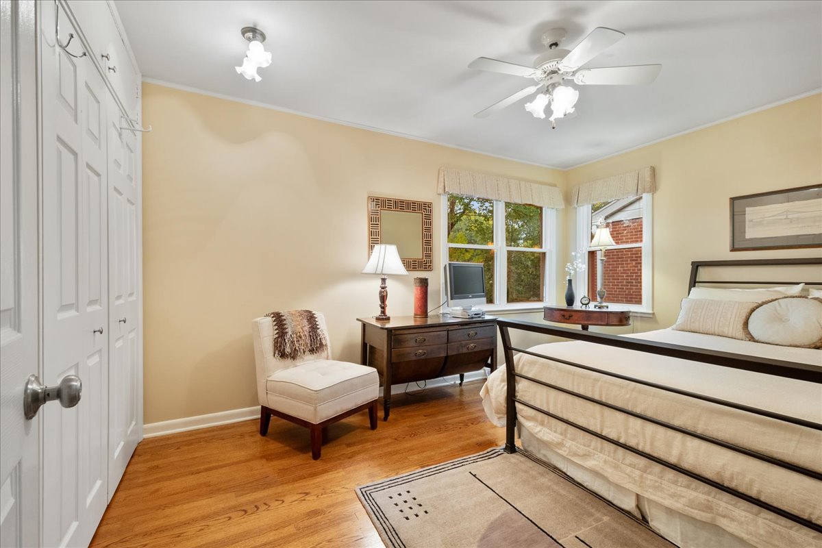 2440 Simpson Street Evanston, IL 60201 - Photo 23 of 34 a living room with furniture and a chandelier