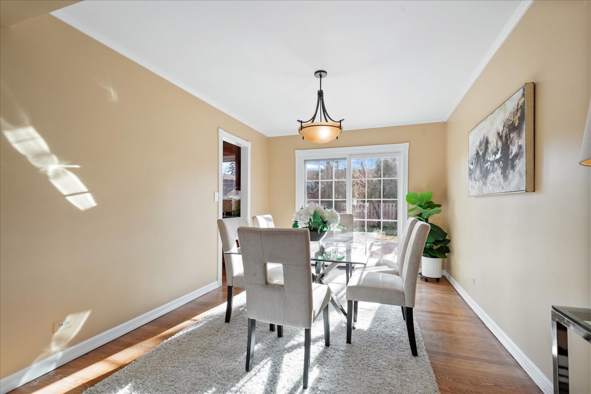 2440 Simpson Street Evanston, IL 60201 - Photo 9 of 34 a view of a dining room with furniture window and outside view