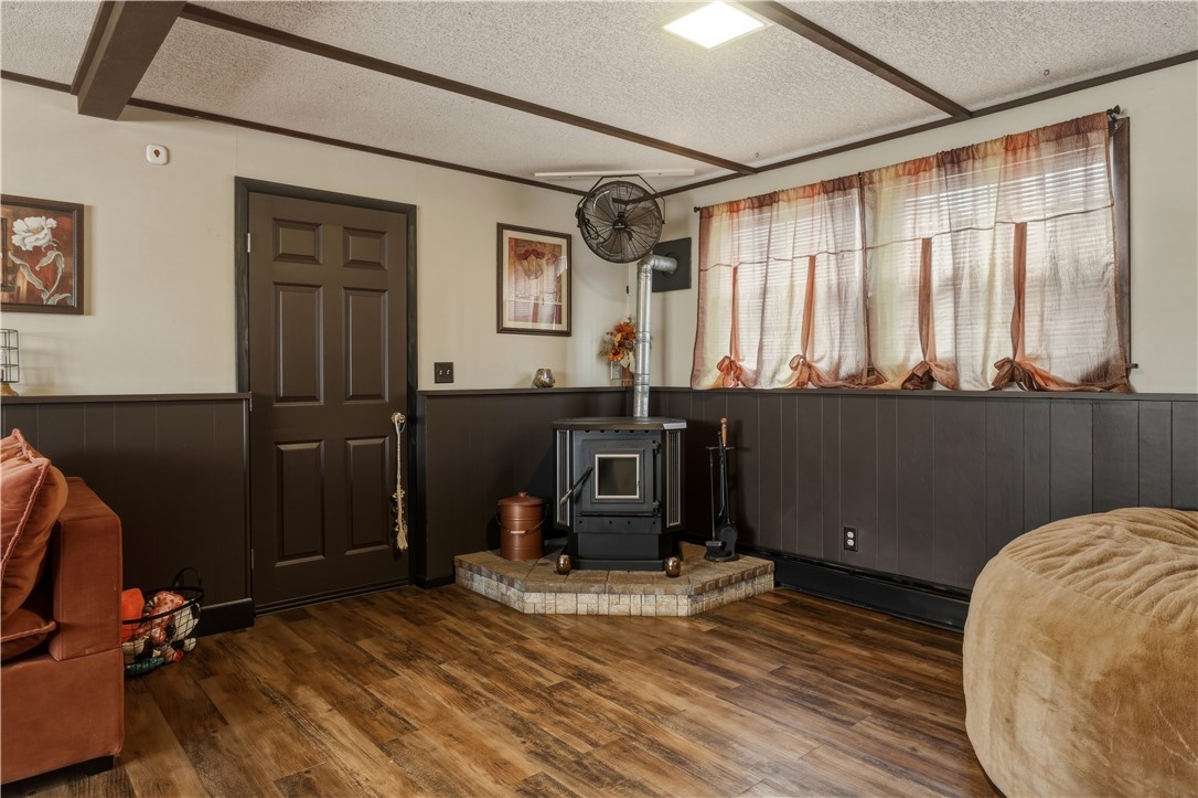 236 Robin Road Horseheads, NY 14845 - Photo 21 of 39 Family Room in the lower level has a pellet stove