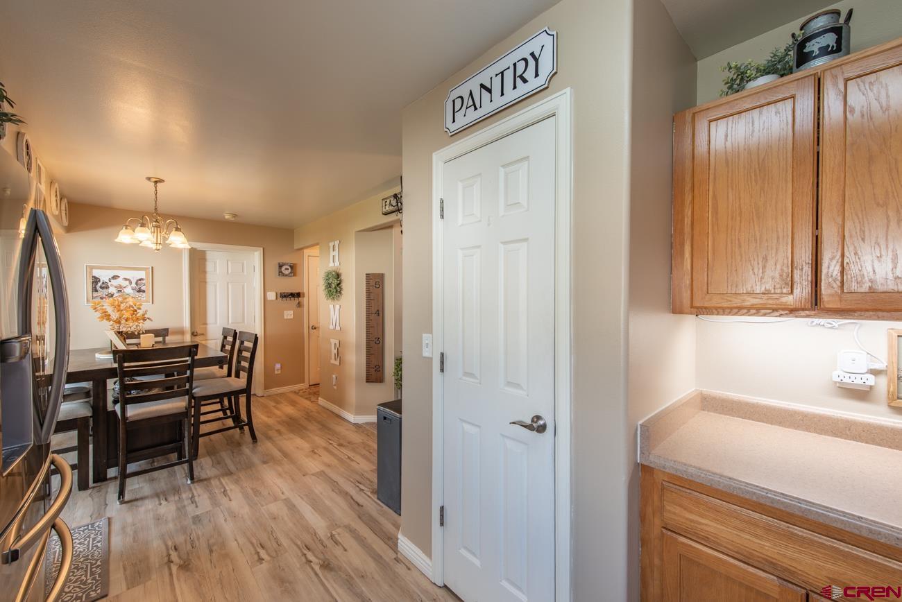 111 6675th Road Montrose, CO 81401 - Photo 12 of 40 a view of a kitchen from the hallway
