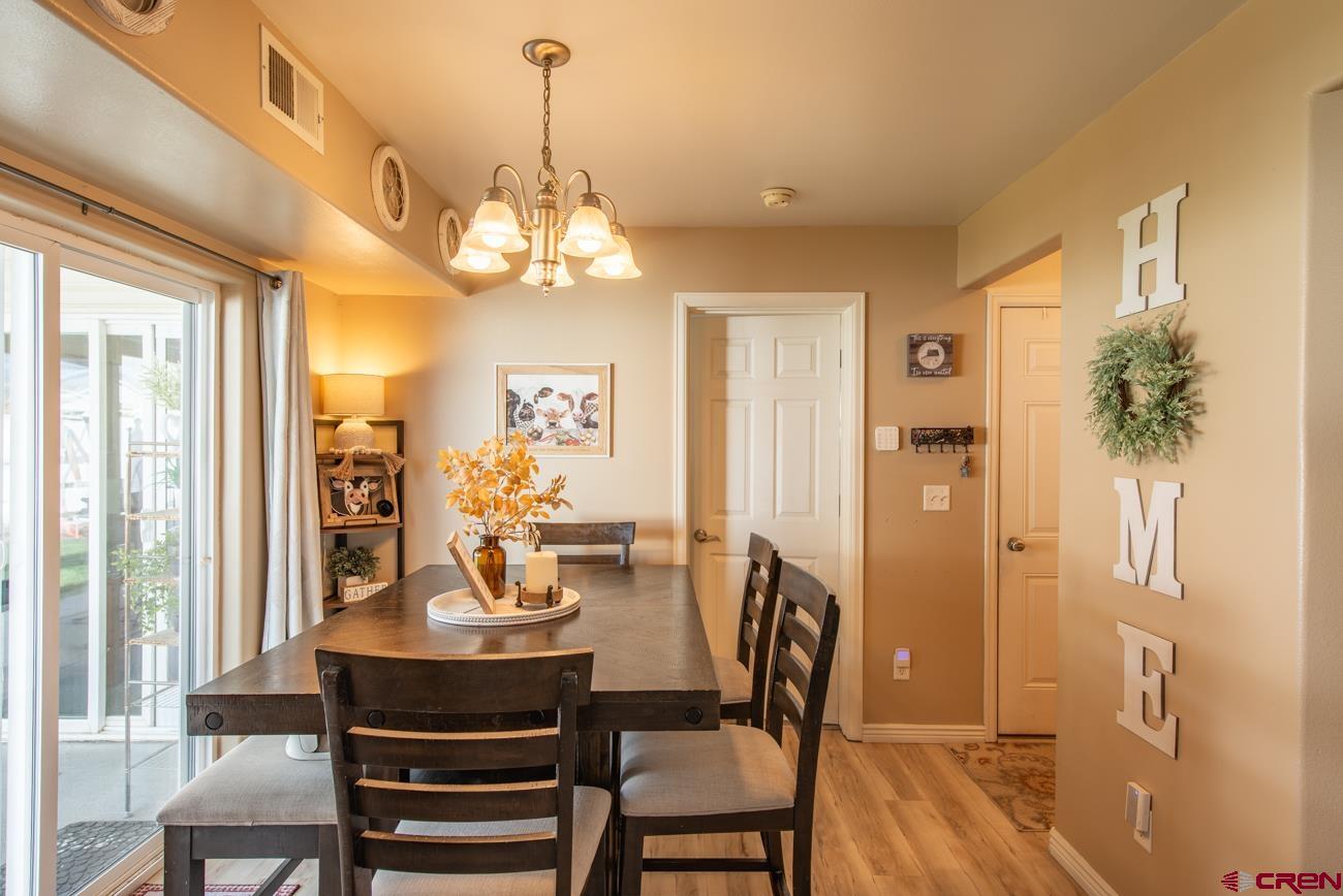 111 6675th Road Montrose, CO 81401 - Photo 13 of 40 a view of a dining room with furniture window and outside view